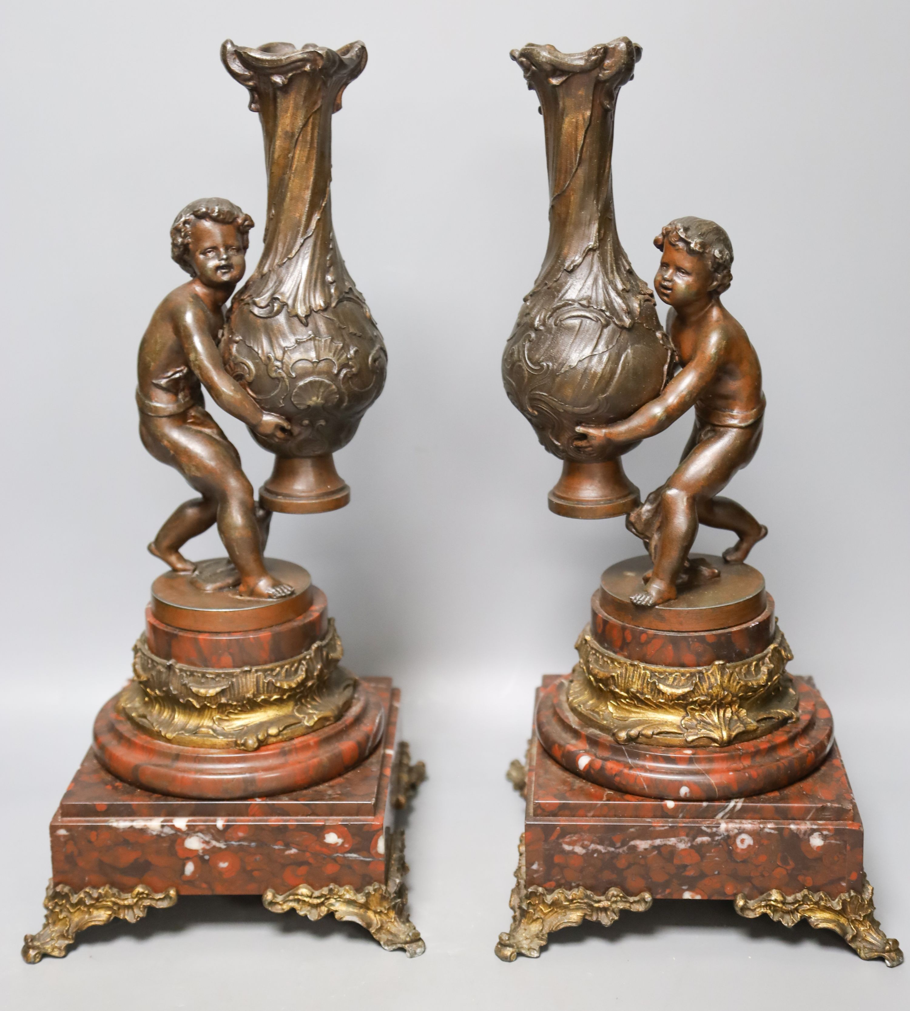 A pair of 19th century patinated spelter and marble figural lamp bases 39cm